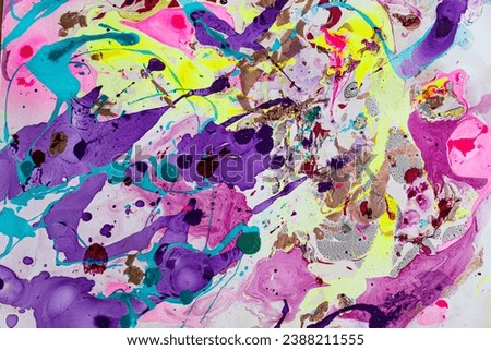 Multicolor texture created with bright and glitter acrylic paints ideal for backgrounds and graphic textures