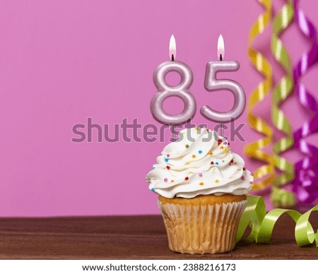 Birthday Cake With Candle Number 85 - On Pink Background.