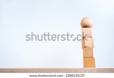 Stand unique, different, leadership concepts. Sphere ball on four wooden cube blocks stack isolated on white background with copy space. Blank wood blocks for text, icons or symbols, design idea.