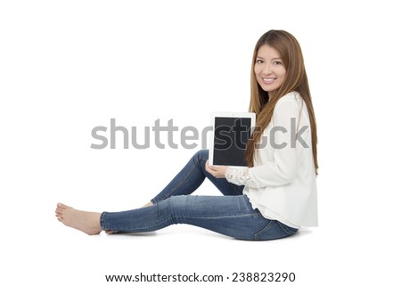 Beautiful woman holding a digital tablet against a white background