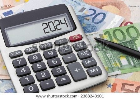Calculator with Euros - 2024 Royalty-Free Stock Photo #2388243101