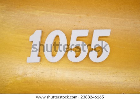 The golden yellow painted wood panel for the background, number 1055, is made from white painted wood.