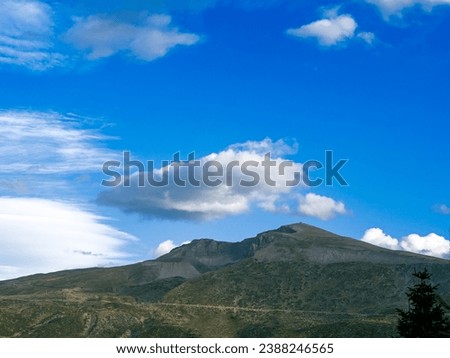 Uludag in Bursa with cloudy blue sky in the background with pine trees. High quality photo