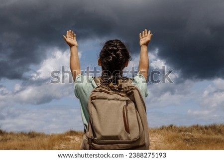 Soulful Journey of a Devoted Religious Seeker in a Tranquil Landscape Royalty-Free Stock Photo #2388275193