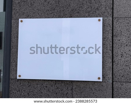 Transparent glass sign plate on wall mockup. Template of a blank business signboard. Transparent Rectangular signboard mock up Royalty-Free Stock Photo #2388285573