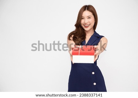 Happy beautiful Asian woman smile and holding gift box isolated on white background. Receiving gifts from lovers. New Year or Christmas concept