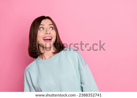 Photo of young pretty woman wondered look empty space imagination isolated over pink color background
