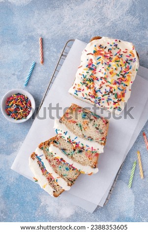 Birthday cake loaf cake or funfetti quick bread with sprinkles and buttercream frosting Royalty-Free Stock Photo #2388353605