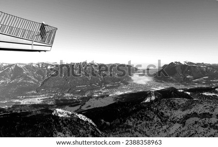 mountain landscape and aerial view of Garmisch-Partenkirchen, Bavaria, Kreuzeck, Germany, fog cloud enters the valley Royalty-Free Stock Photo #2388358963