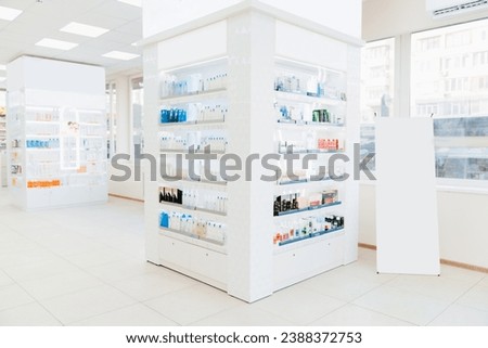 Empty drugstore chemist`s shop pharmacy without staff clients customers visitors with remedies, pills, medicines, goods, painkillers, jars on shelves Royalty-Free Stock Photo #2388372753