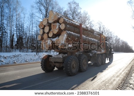 Winter frozen road. Beautiful and danger. logging truck the same as in famous scary movie.