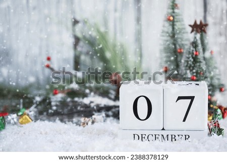 National Pearl Harbor Day of Remembrance. White wood calendar blocks with the date December 7th with snow. Selective focus with blurred background. 
