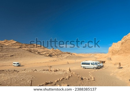 Tourist attraction Valley of the Moon (Valle de La Luna) in the Atacama Desert, Chile. Blue sky and arid climate.