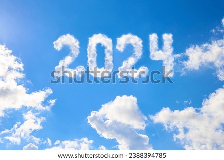 2024 year written on a blue sky of clouds. Concept of happy New year.