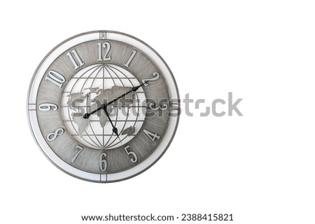 Wall clock in the shape of a world map in gray color isolated on a white background Royalty-Free Stock Photo #2388415821