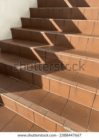 A picture of shadow of a staircase on a hot day.