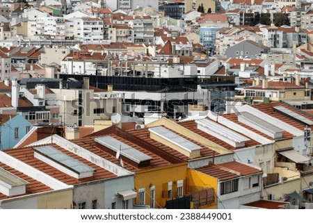 View from panoramic viewpoint overlooking Lisbon cityscape with sprawl of city building rooftops