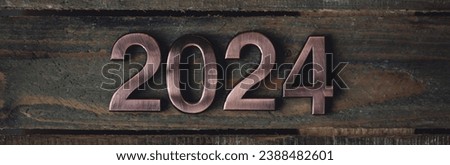 2024 Christmas or New Year minimalistic composition. Holidays card on wooden background, zero waste decorations. Sustainable lifestyle, natural elements. Banner
