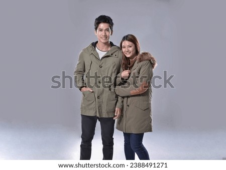 photo of handsome young couple posing. Studio shot
	

