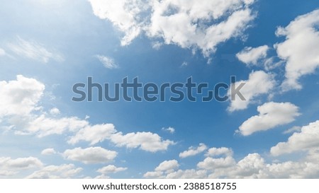  Panoramic view of clear blue sky and clouds, Blue sky background with tiny clouds. White fluffy clouds in the blue sky. Captivating stock photo featuring the mesmerizing beauty of the sky and clouds.