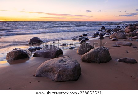 large rocks on the beach in the evening