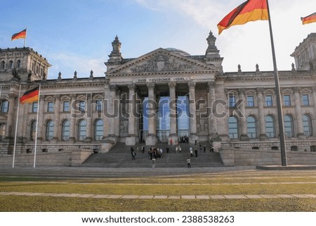 Reichstag building The dedication Dem deutschen Volke, meaning To the German people, can be seen on the frieze above the entrance. Royalty-Free Stock Photo #2388538263
