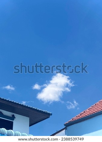 The tiny clouds with Roof of the house creates look up the image so calm and peace feel like a casual day.