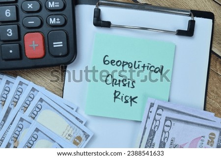 Concept of Geopolitical Crisis Risk write on sticky notes isolated on Wooden Table.