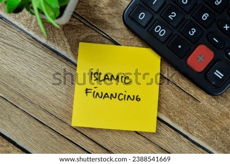 Concept of Islamic Financing write on sticky notes isolated on Wooden Table.