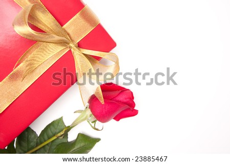 Gift with Gold Ribbon and Rose Isolated on a White Background.