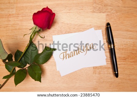 Thank You Card, Pen and Red Rose on a Wood Background.