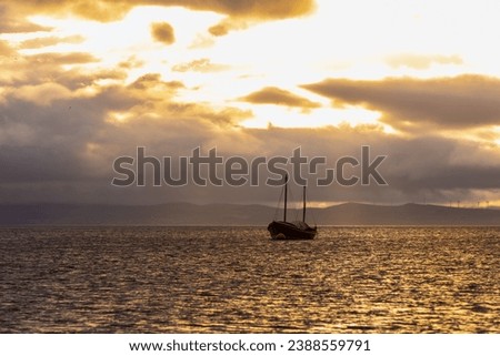 beautiful morning sky with a yacht on the sea