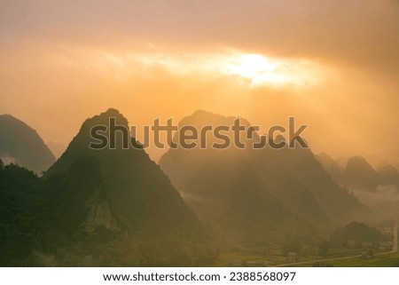 Aerial view of sunrise on mountain at Ngoc Con ward, Trung Khanh town, Cao Bang province, Vietnam with beautiful river, nature, green rice fields. Near Ban Gioc waterfall. Travel and landscape concept