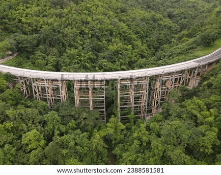 An aerial view of Road or bridge is in the middle of a forest:Use for website banner background,backdrop