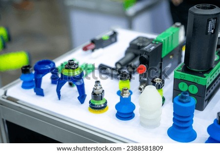 Vacuum grippers and suction cups for food automation. Vacuum gripper and suction cup systems for robotic food handling and packaging applications. Suction cup and gripper technology in food industry. Royalty-Free Stock Photo #2388581809