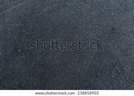 Black hot blacktop concrete on road surface not under compression yet Royalty-Free Stock Photo #238858903