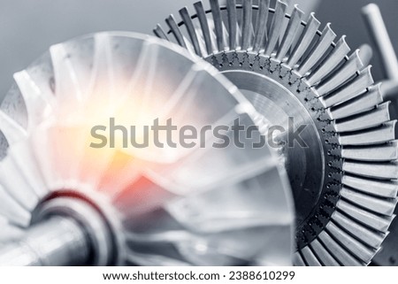 Macro steel blades of turbine propeller blue color with sunlight. Royalty-Free Stock Photo #2388610299