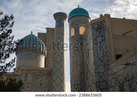 two historical building near to each other with the colorful geometry in it, Registan square, Samarkand, madrasah.