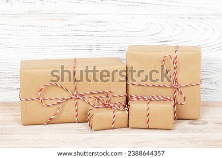 Brown gift boxes on grey wooden table.