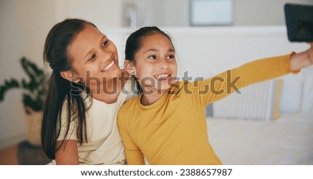 Selfie, sister and happy with girl children in the bedroom of their home together for a social media profile picture. Family, smile and sibling kids on a bed in their apartment to update a status
