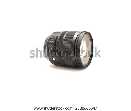 Front view advanced aspherical landscape lens made in Japan for DSLR full frame camera photography isolated on white background with clipping path copy space. Digital photo equipment accessory