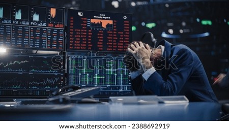 Stressed Stock Exchange Trader Can't Apprehend a Sudden Stock Market Collapse. Financial Crisis Concept with Stock Broker Saddened by Negative Ticker Information, Red Graphs and Real-Time Data Royalty-Free Stock Photo #2388692919