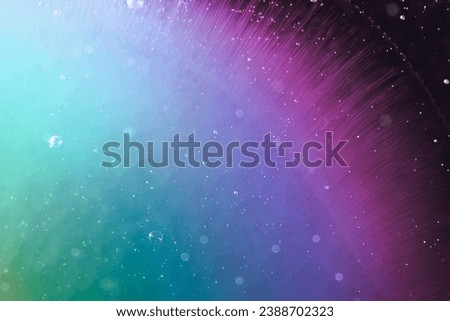 rainbow liquid paint, abstract space themed background Royalty-Free Stock Photo #2388702323