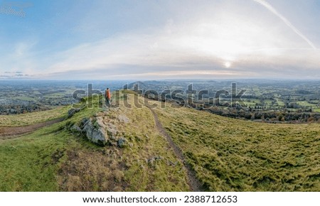 amazing view of Hiker standing of the peak the Malvern Hill of Great Malvern, Worcestershire, United Kingdom, Autumn daytime