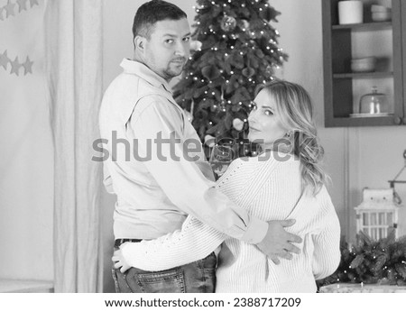 Black and white photo of a married couple, viewed from the back. New Year. Relationships concept