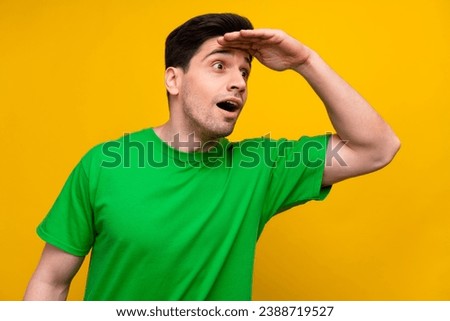 Photo portrait of nice young brunet male hand forehead explore wear trendy green garment isolated on yellow color background