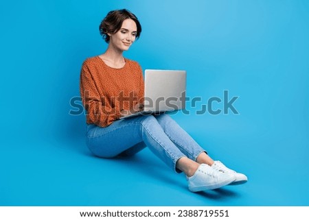 Full length photo of lovely young lady apple macbook samsung work netbook wear trendy brown garment isolated on blue color background
