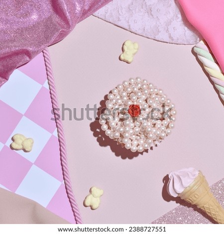 Inspirational cute girly candy pink background, sweets, pearls, gummy bears, ice cream, swirled candy, creative mess.