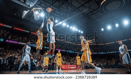 Cinematic Basketball Action on Streaming Service: White Team Scores a Beautiful Goal. After A Teammate Reflects the Ball from a Shield, Another Player Performs a Fast Powerful Rebound Slam Dunk. Royalty-Free Stock Photo #2388728389