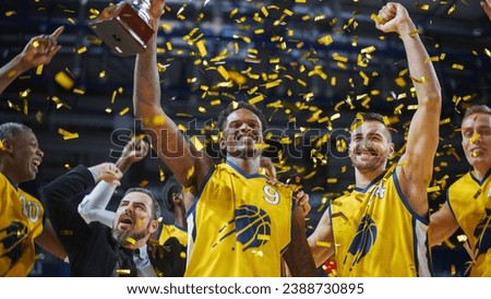 Multiethnic Basketball Players Celebrate Championship Victory with Hugs, Jumping, And Holding the Trophy High. Exclusive Joyful Sports Action on Live TV and Pay Per View Internet Streaming Concept.